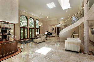 Elegant living room with marble floors and stairway